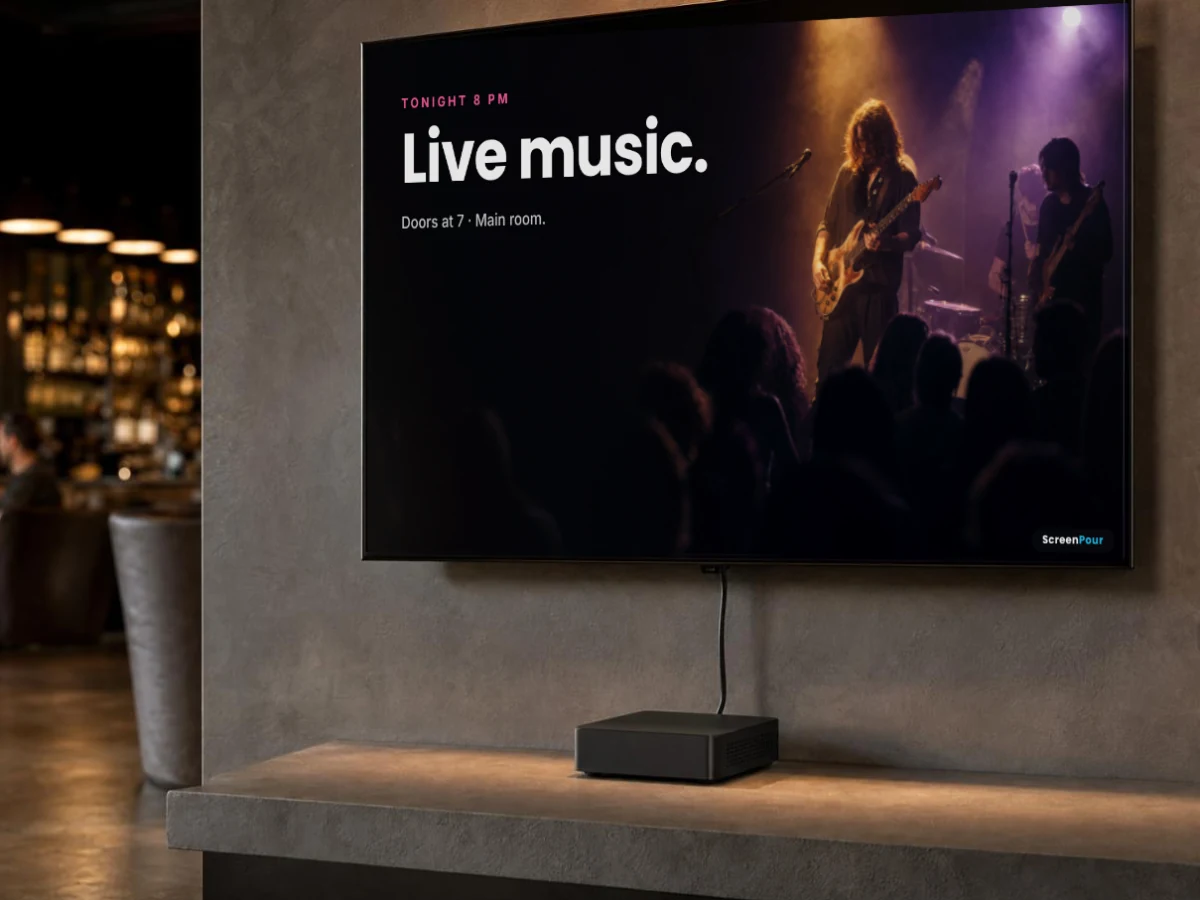A wall screen in a venue showing tonights live music, run by a small commercial player on the shelf below